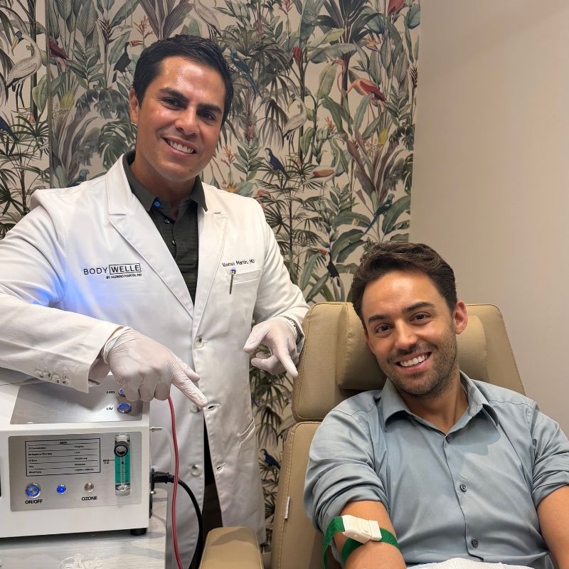 Dr. Alonso Martin with a patient during an EBOO treatment.
